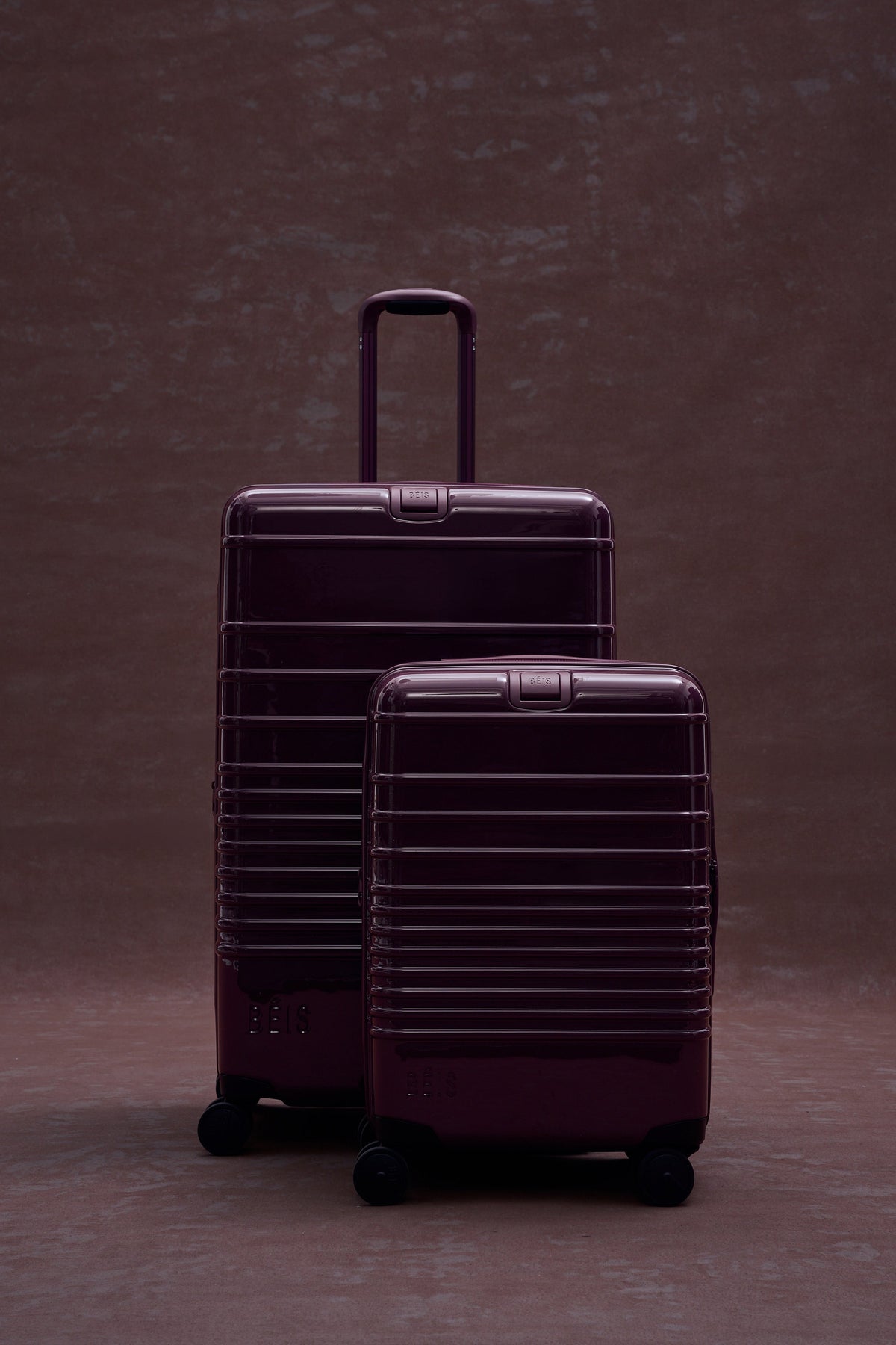 The Large Check-In Roller in Glossy Plum