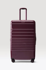 The Large Check-In Roller in Glossy Plum