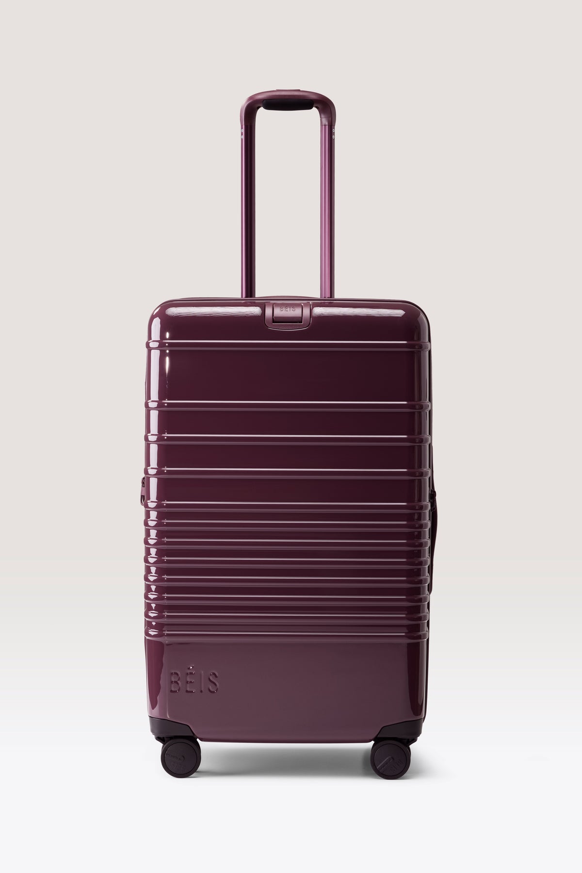 The Medium Check-In Roller in Glossy Plum