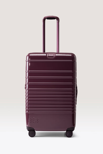 The Medium Check-In Roller in Glossy Plum